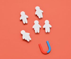 The picture shows cut-outs of children to represent student retention.