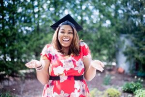 The picture is of a young woman shrugging in a graduation cap to represent the mystery of the price of college and discounts.